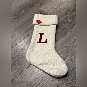 Large “L” Knit monogram Christmas stocking in white.